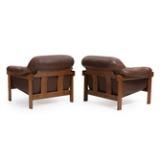A Pair Of Stained Oak Easy Chairs by 
																			Percival Lafer