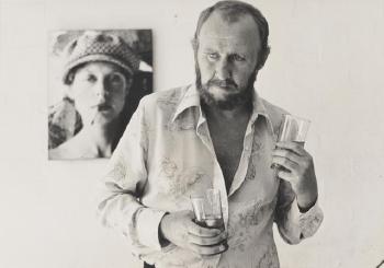 Bill Hunter with Photograph of Judy Morris In Background on The Set of In Search Of Anna by 
																	Carol Jerrems