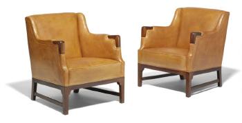 A pair of easy chairs with frame and armrests by 
																	 C B Hansens Etablissement