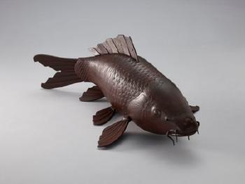 An iron articulated sculpture of a large carp by 
																	Tomiki Isuke