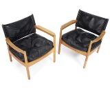 A pair of oak easy chairs by 
																			Gunnar Myrstrand
