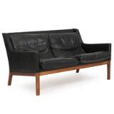 Freestanding two seater Brazilian rosewood sofa by 
																			Kai Lyngfeldt Larsen