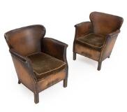A pair of armchairs with stained beech legs by 
																			Otto Schulz