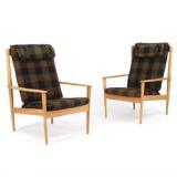 A pair of high back oak easy chairs, back with vertical slats by 
																			 P Jeppesen