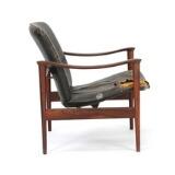 Easy chair of rosewood. Seat and back upholstered with black leather. Model 711 by 
																			Fredrik A Kayser