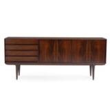 A rosewood sideboard front with four drawers and two sliding doors. Model 18 by 
																			 Omann Jun Mobelfabrik
