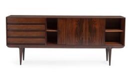 A rosewood sideboard front with four drawers and two sliding doors. Model 18 by 
																			Gunni Omann