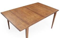 Rectangular rosewood dining table with two leaves by 
																			Henry Rosengren Hansen