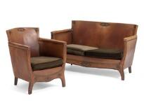 Two-seater sofa and easy chair upholstered with brown patinated leather with brass nails by 
																			Otto Schulz