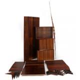 Wall unit of rosewood consisting of five back pieces three cabinets shelves shelves holders and side pieces by 
																			 Cado Co