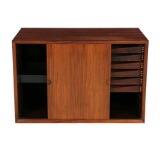 Wall unit of rosewood consisting of five back pieces three cabinets shelves shelves holders and side pieces by 
																			Poul Cadovius