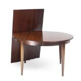 A circular rosewood extension table with three extra leaves one leaf with apron Model 55 by 
																			Gunni Omann