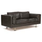 Free-standing two-seater sofa with round chromed steel legs sides and loose cushions upholstered with brown coloured leather by 
																			 Ryesberg Mobler