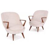 A pair of easy chairs of stained beech by 
																			 Poznanskie Fabryki Mebli