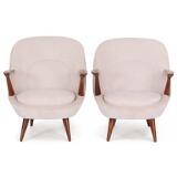 A pair of easy chairs of stained beech by 
																			J Jedrachowicz