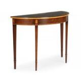 A 'demi lune' Regency style mahogany console table by 
																			 Hansen and Terp