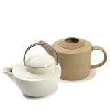 A Bing & Groendahl stoneware tea pot. No. A21 and an Arabia porcelain tea pot with metal handle by 
																			Ole Palsby