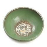 A earthenware bowl, decorated in green glaze by 
																			Jens Peter Dahl-Jensen