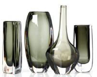 Nine vases and two bowls of clear glass, with olive green and steel blue glass underlay by 
																			Nils Landberg