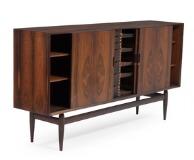 Rosewood sideboard, front with four sideboards with integrated handles interior with shelves and 12 larger and minor drawers with visible joints by 
																			Henry Rosengren Hansen