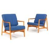 A pair of easy chairs of beech, armrests of teak by 
																			Tove Kindt-Larsen
