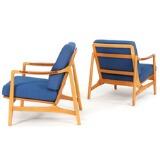 A pair of easy chairs of beech, armrests of teak by 
																			Tove Kindt-Larsen