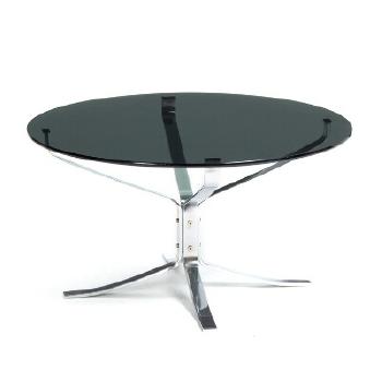 A circular coffee table with chromed steel frame and glass top by 
																	 Vatne Mobler