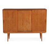 Tall sideboard of teak with three sliding doors, inside with shelves and pullout trays by 
																			Gunni Omann