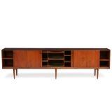 Sideboard of rosewood, front with four sliding doors. Inside with shelves and pullout trays by 
																			Henry Rosengren Hansen