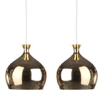 Löket A pair of brass pendants by 
																	Helge Zimdal