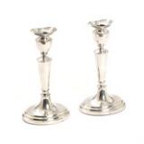 A pair of silver candlesticks by 
																			Willy Volmers