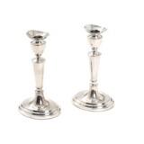 A pair of silver candlesticks by 
																			Willy Volmers