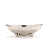 Oval sterling silver bowl. Curving sides and four small feet by 
																			Karl Gustav Hansen