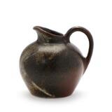 Stoneware pitcher decorated with grey and brown spotted glaze by 
																			Eva Staehr-Nielsen