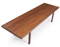 A rectangular solid teak coffee table with octagonal legs by 
																			 Mikael Larsen