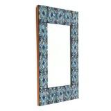 Rectangular wall mirror with frame of copper plates decorated with enamel in shades of blue white and golden by 
																			Bodil Eje