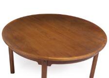 A Circular Teak Dining Table With Four Extension Leaves one with apron, one folding support leg by 
																			 P Lauritsen & Sons