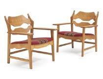 A Pair of Oak Easy Chairs by 
																			Henning Kjaernulf