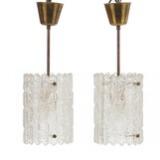 A Pair of Brass Pendants With Glass Shades by 
																			Carl Fagerlund