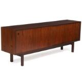 Rosewood sideboard, front with two sliding doors, inside with adjustable shelves and trays by 
																			Gunni Omann
