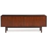 Rosewood sideboard, front with two sliding doors, inside with adjustable shelves and trays by 
																			Gunni Omann