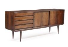 A rosewood sideboard, front with four drawers and two sliding doors by 
																			 Omann Jun Mobelfabrik