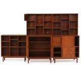 Wallunit of solid teak consisting of cabinet with tambour doors, cabinet with sliding doors and three bookcases by 
																			 Soborg Mobler