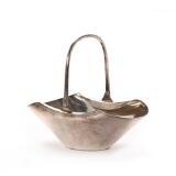 Basket-shaped confectionary bowl of silver plated metal with movable handle by 
																			 Hukin & Heath