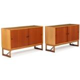 A pair of sideboards of oak with runner legs, doors and shoes of teak by 
																			 Karl Andersson and Soner