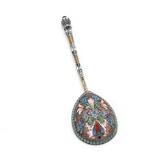 A Russian cloisonné enamelled silver spoon adorned with flowers and leaves in green, blue, red and white by 
																			Ivan Saltykov