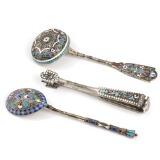 Three pieces of Russian late th century silver decorated with cloisonné enamel comprising spoon, straining spoon and sugar tongs by 
																			Ivan Saltykov