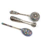 Three pieces of Russian late th century silver decorated with cloisonné enamel comprising spoon, straining spoon and sugar tongs by 
																			Ivan Saltykov