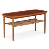 Coffee table of mahogany with shelf of woven cane and raised edge by 
																			Thorald Madsens