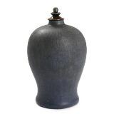 Altered stoneware table lamp by 
																			Patrick Nordstrom